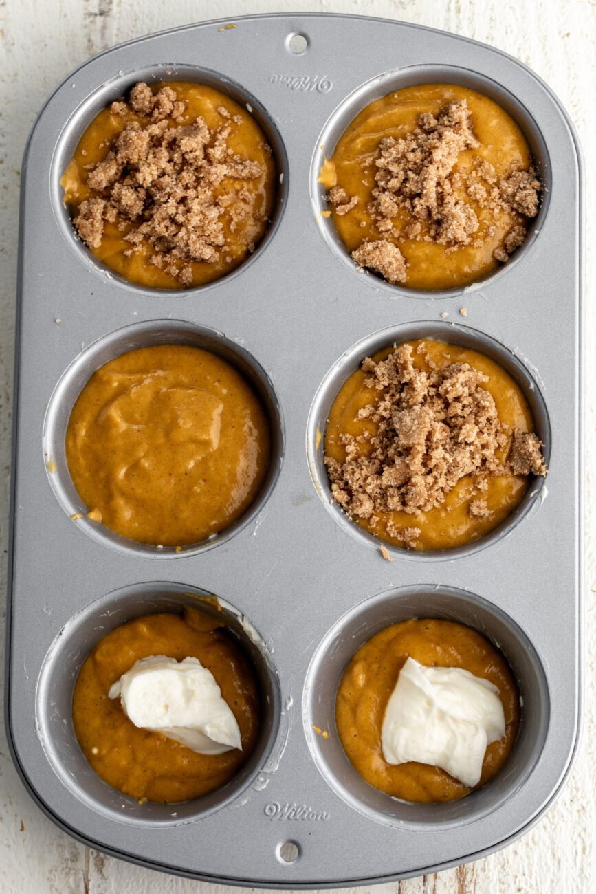 assembled pumpkin muffin batter in jumbo muffin tin.