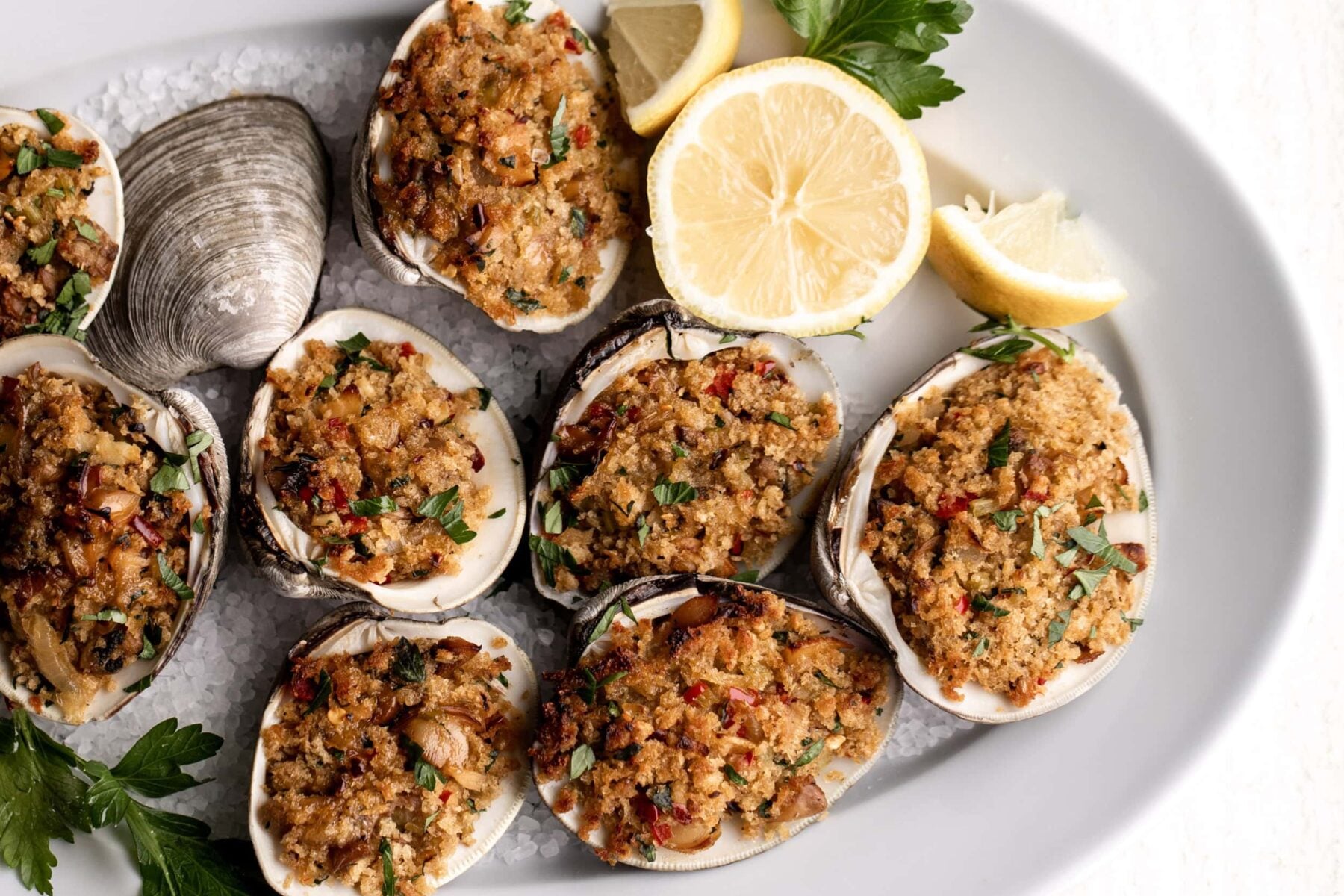 Baked Stuffed Clams Recipe garnished with lemon.