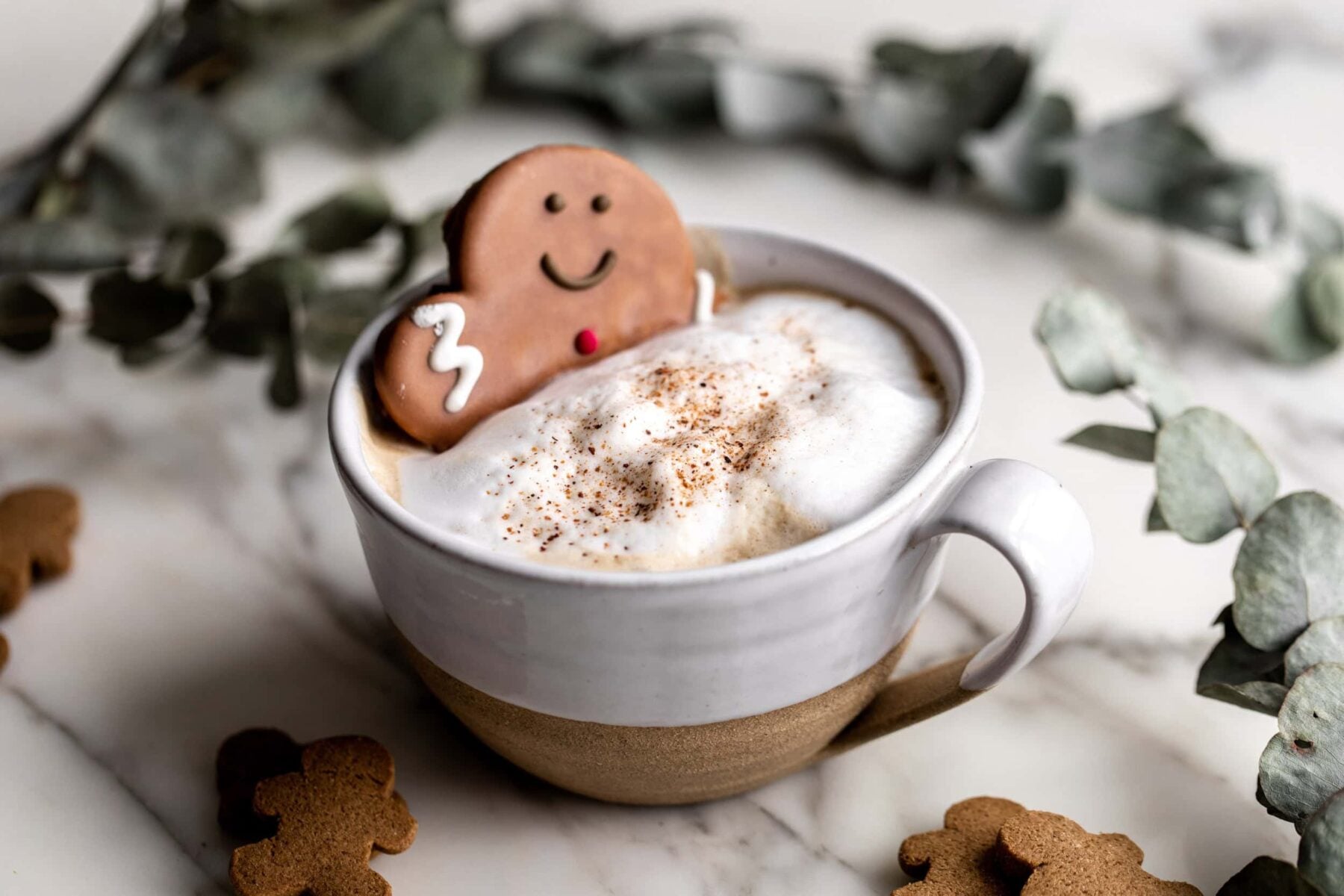 Gingerbread Latte with gingerbread man sticking out,