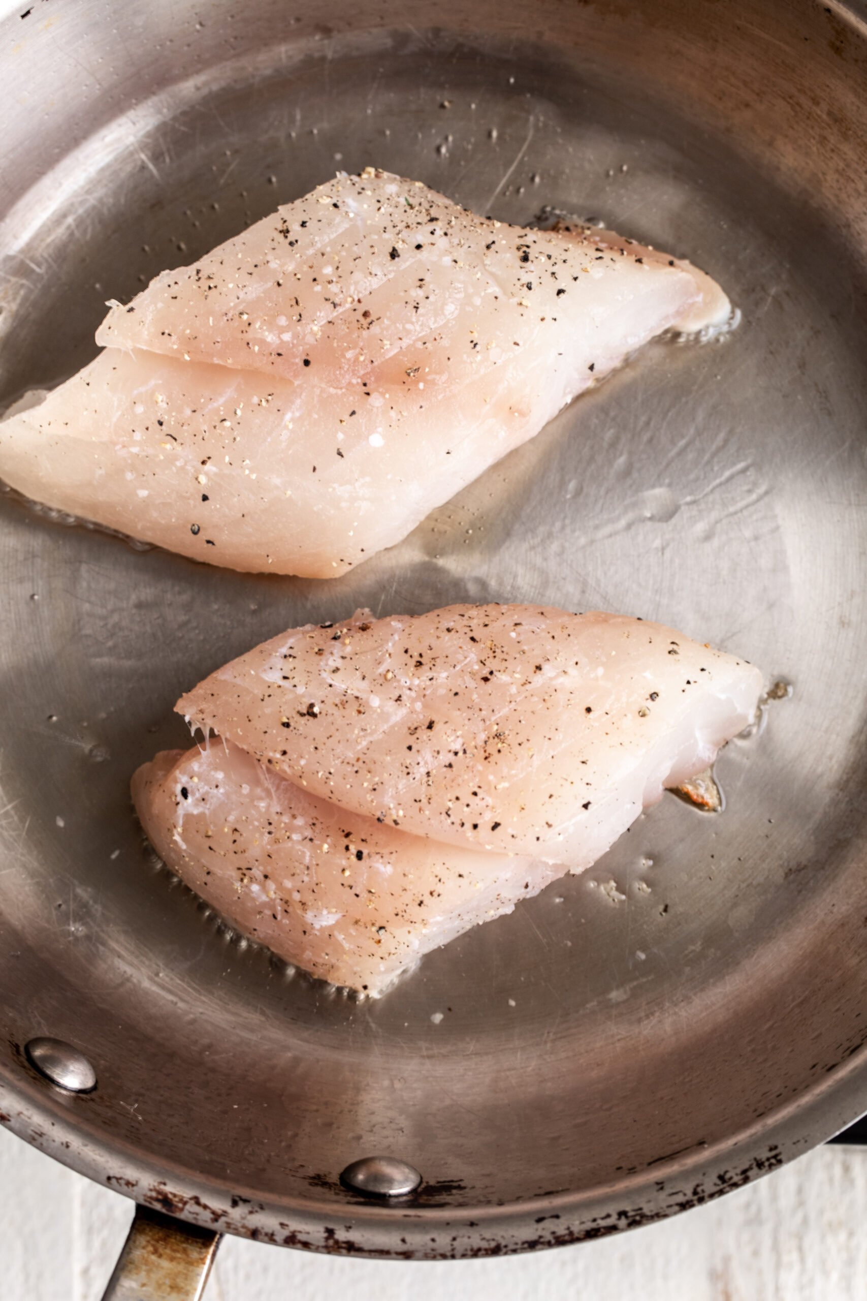 PanSeared White Fish Cooking with Cocktail Rings