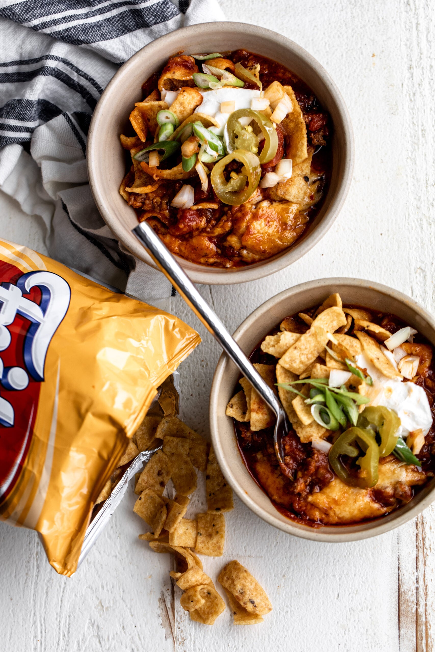 Chili Cheese Frito Pie layered with crunchy chips, chili, and melted cheese.