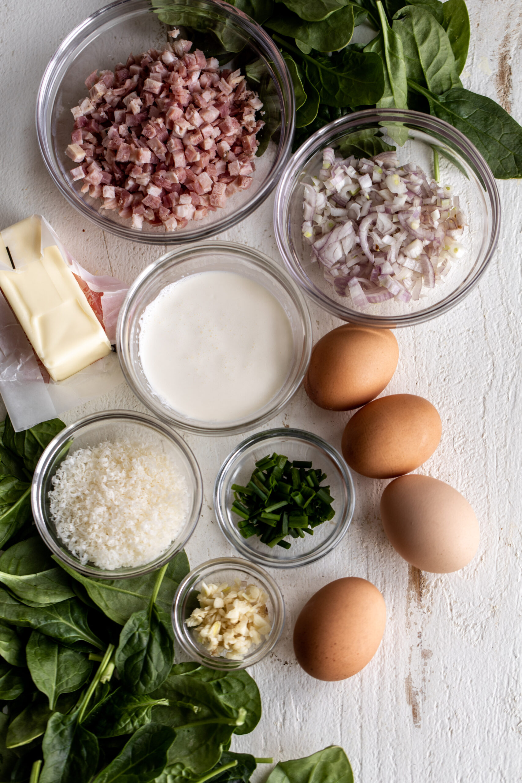 diced pancetta with shallots, cream, spinach and eggs ingredients.