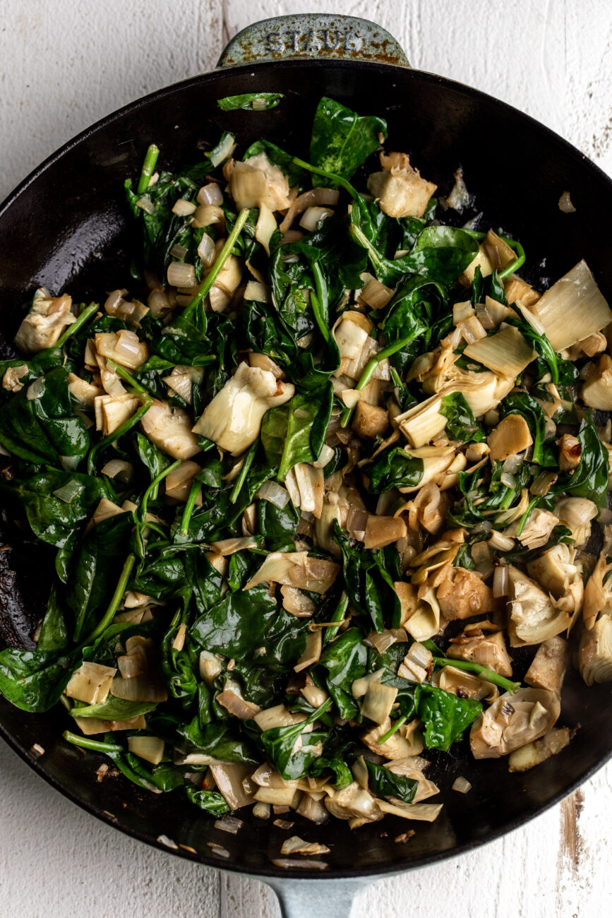 Step 3: Add spinach and artichokes.