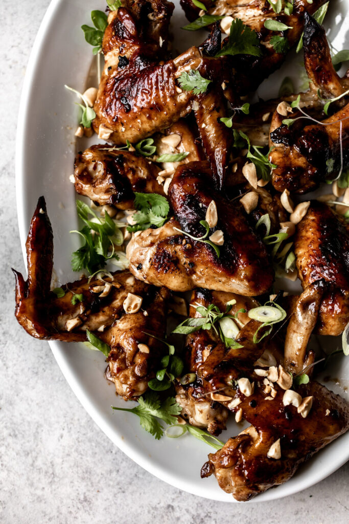 whole chicken wings in soy marinade with peanuts and herbs