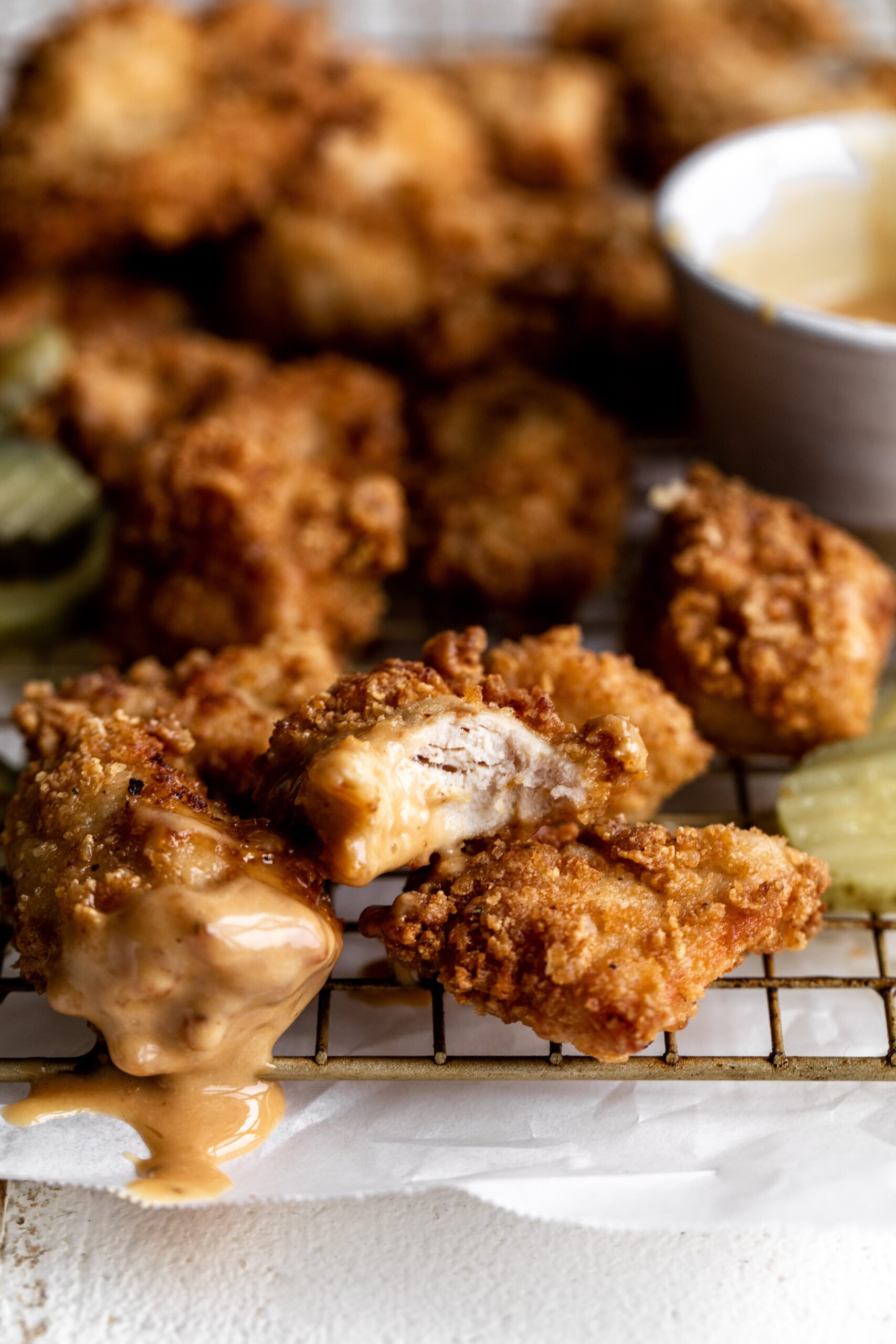 Crispy Chicken Nuggets with bite dipped in Tangy chick fil a Sauce.