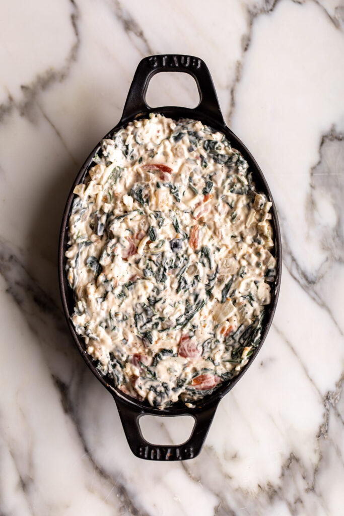 hot spinach dip in cast iron pan