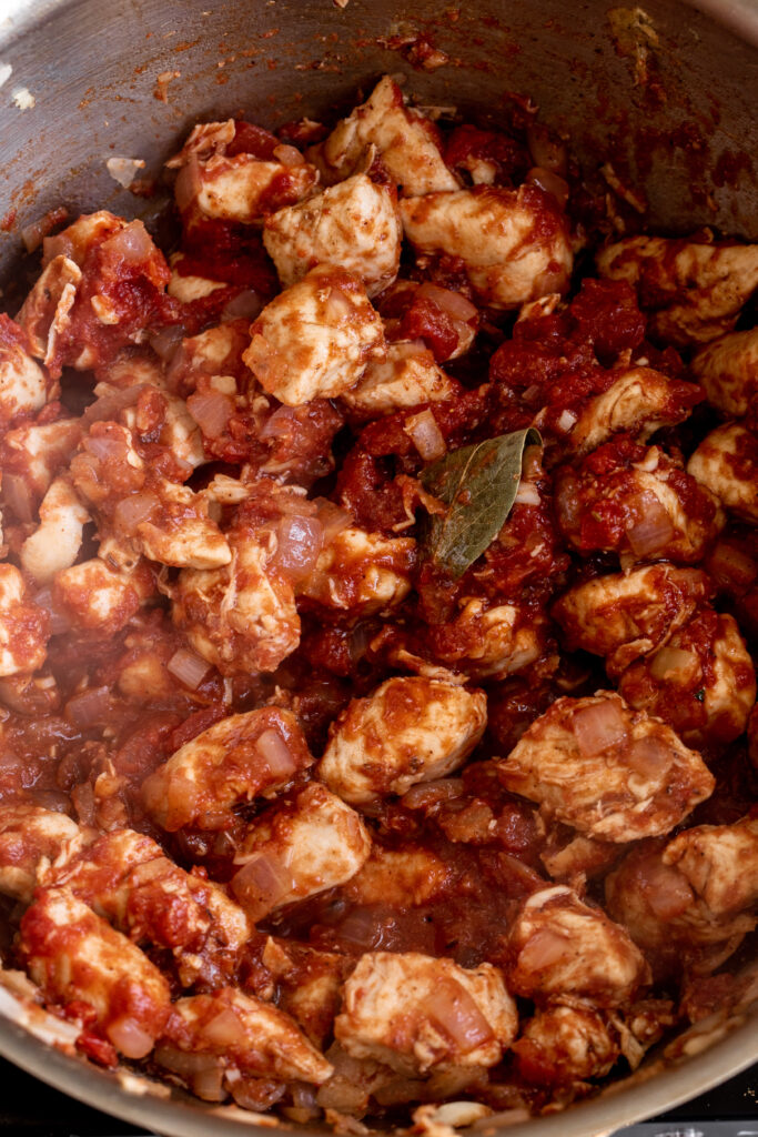 chicken simmered in tomato paste and crushed tomato mixture