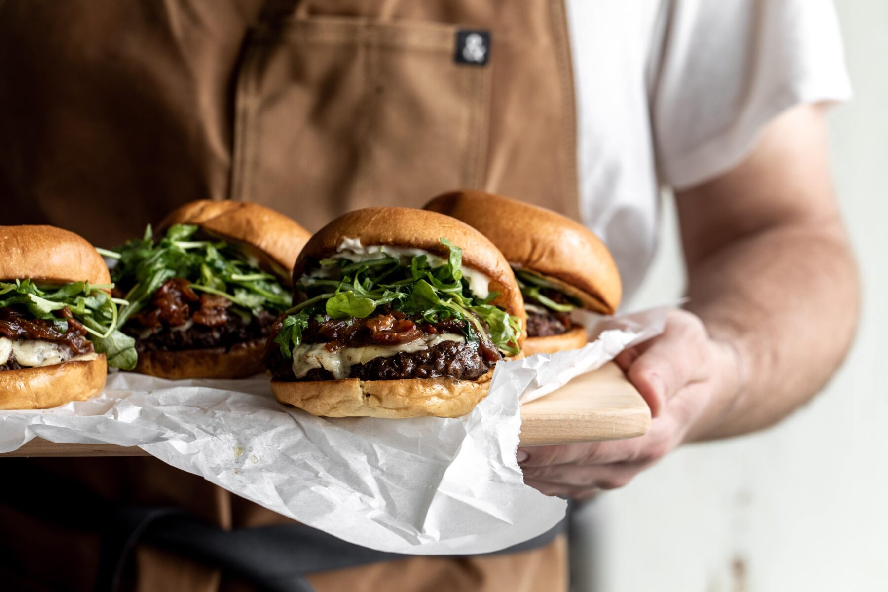 french onion soup cheeseburger with arugula.