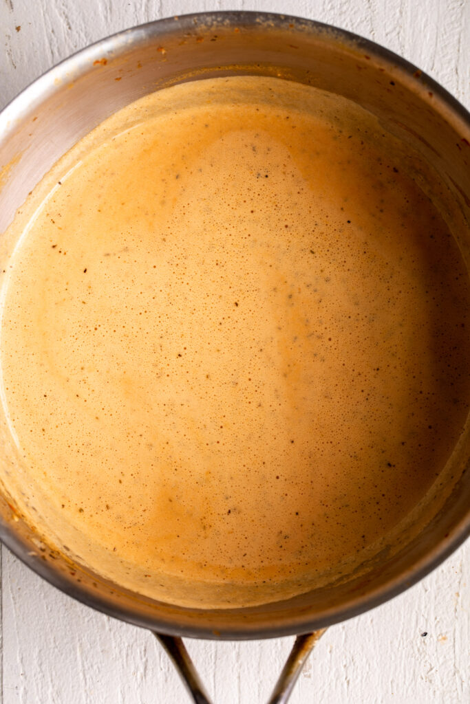 blended roasted red pepper sauce in pot