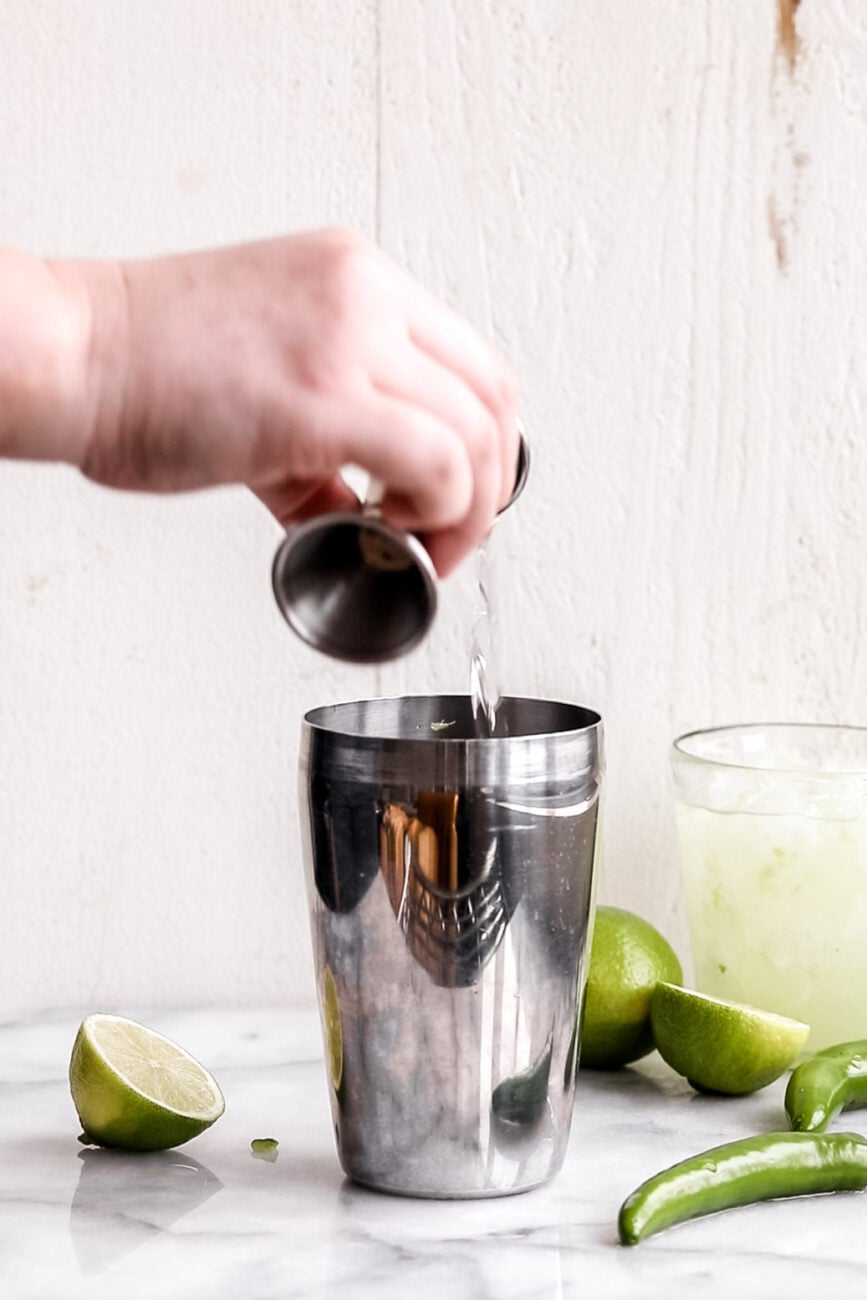 tequila triple sec and lime juice in shaker.