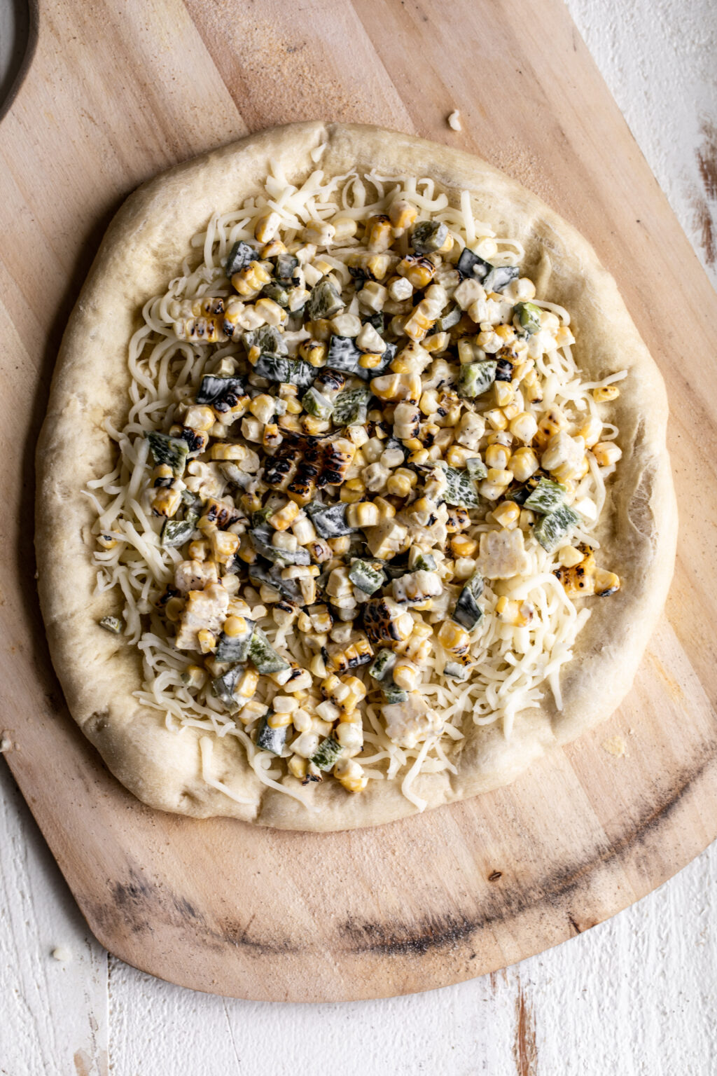 Elote Pizza Cooking with Cocktail Rings