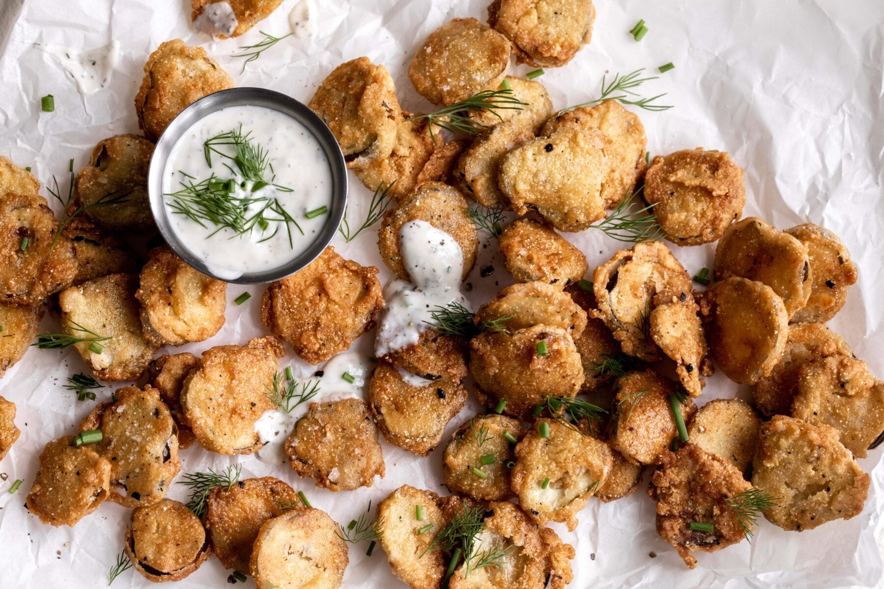 fried pickles with buttermilk ranch and herbs.