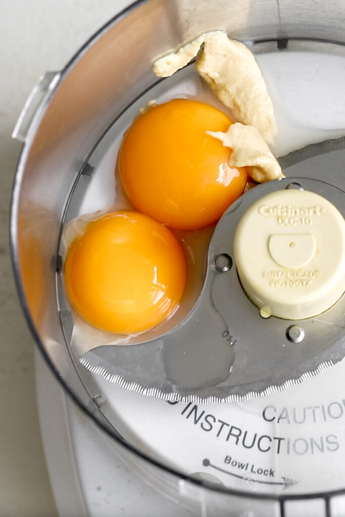 adding egg to food processor for homemade mayonnaise 