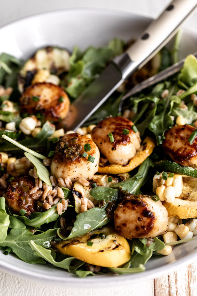 arugula with brown butter scallops and grilled zucchini and corn