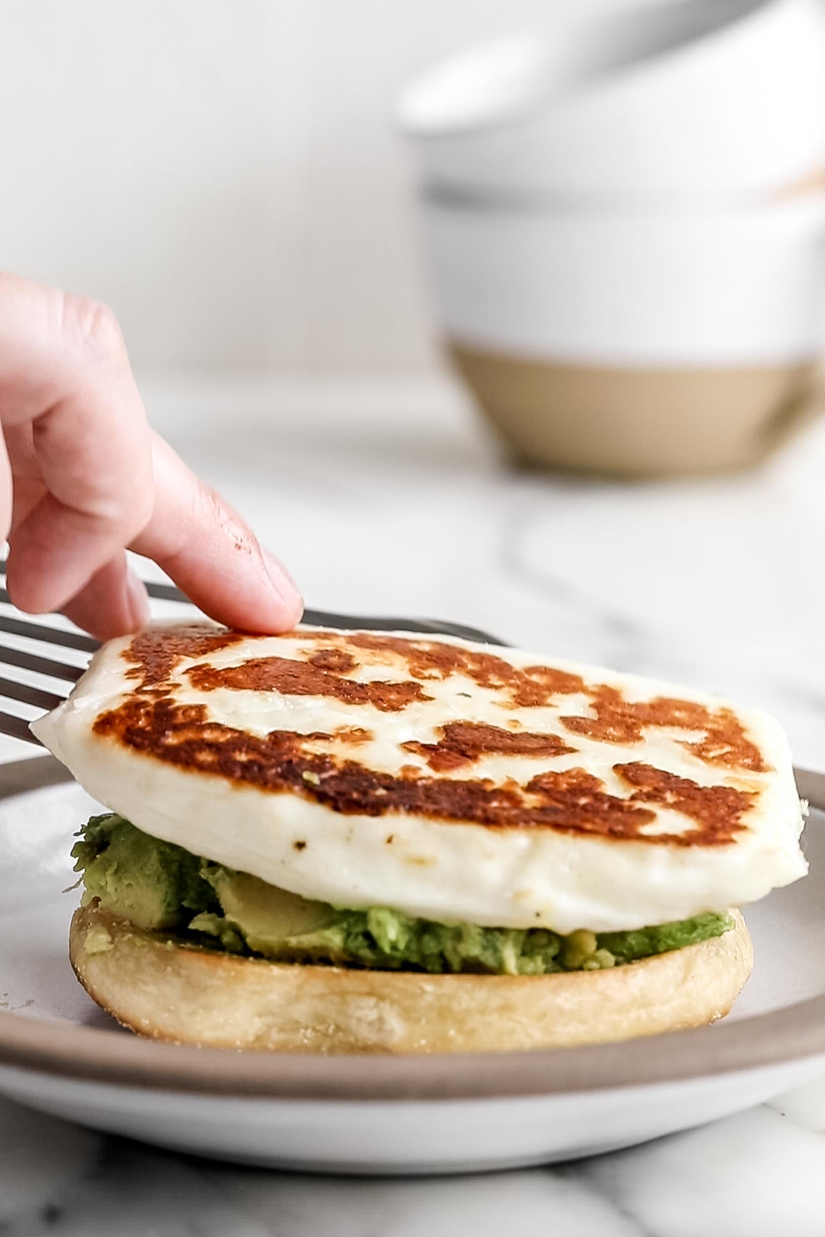 assembling the Crispy Halloumi Cheese sandwich.
