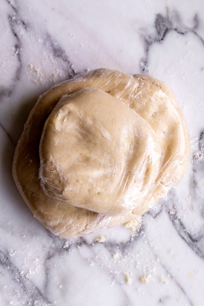 chilled shortbread pie crust in plastic wrap.
