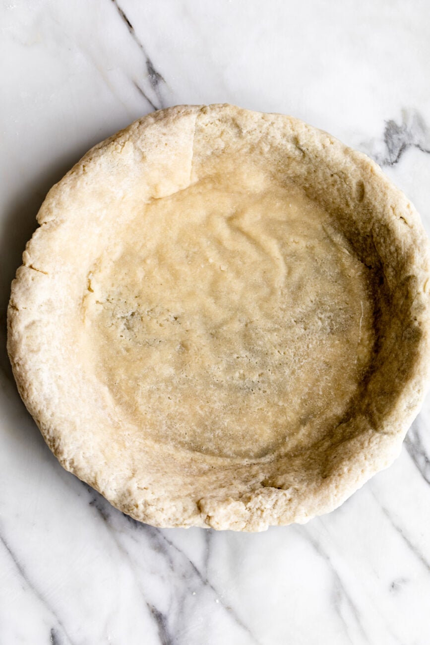 par-baked pie crust in pie tin.