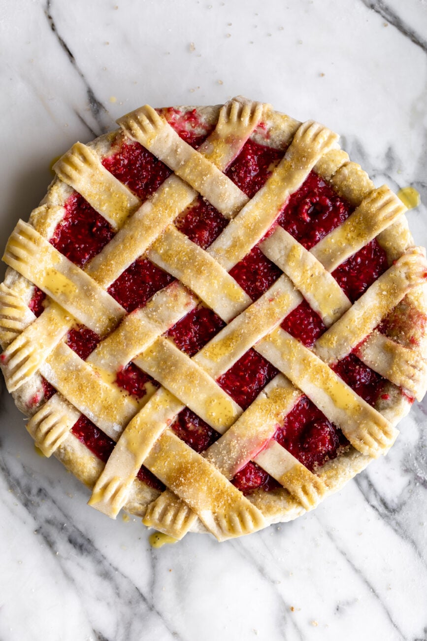raspberry pie with shorbread crust ready for oven.