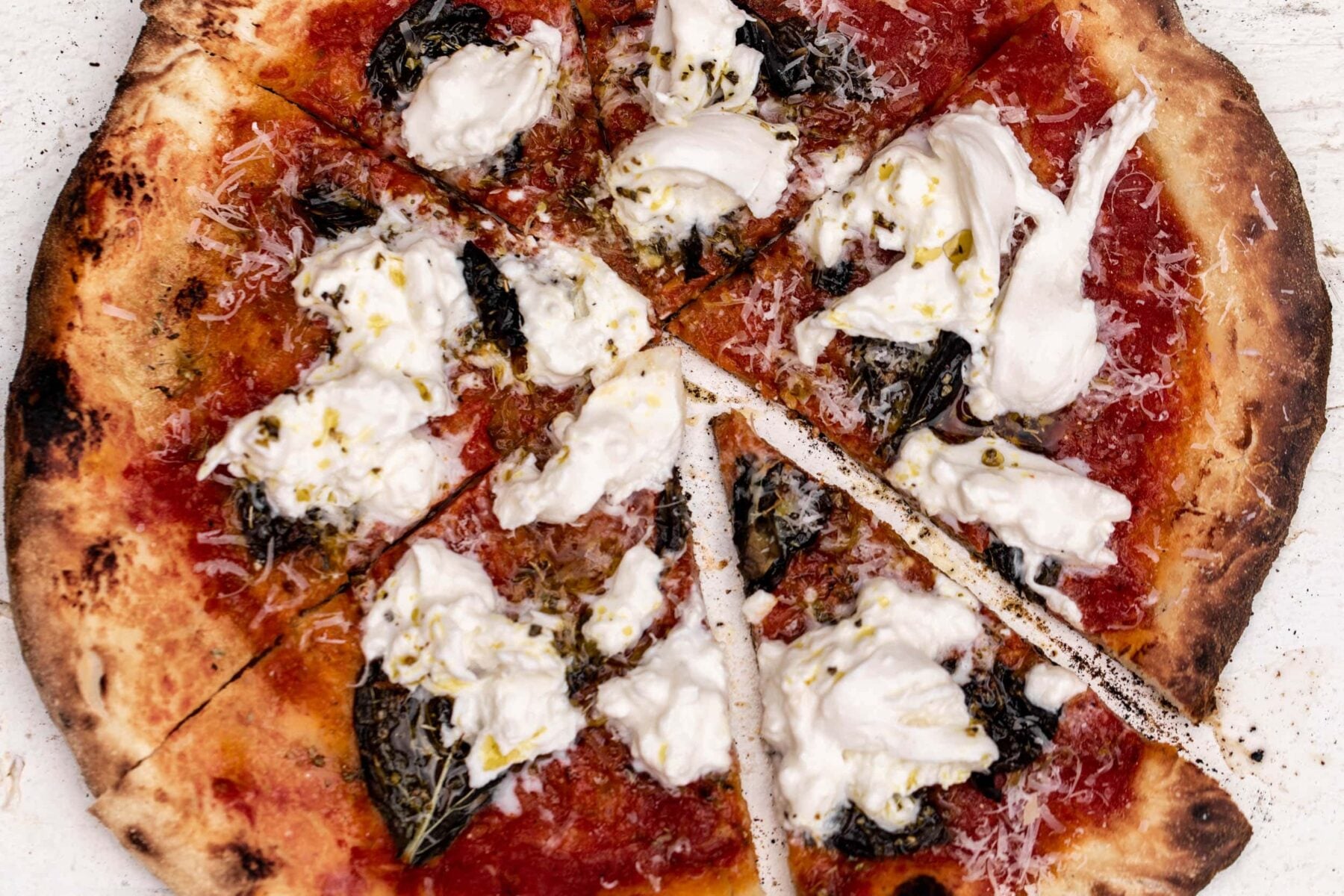 burrata pizza pie with basil.