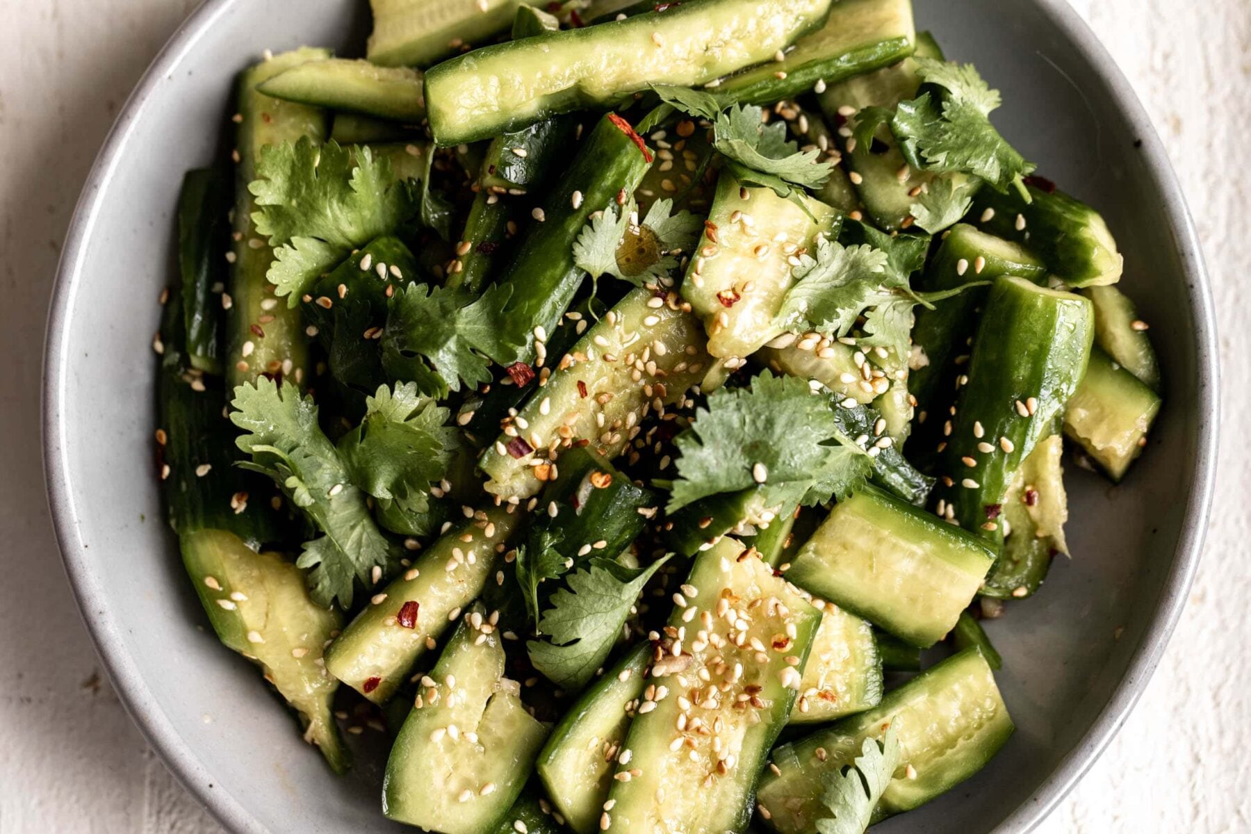 smashed cucumber salad with cilantro and sesame.