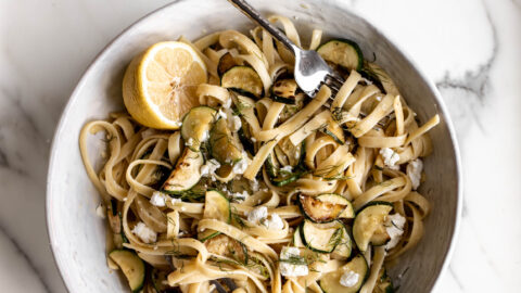 zucchini and feta fettuccine pasta topped with dill