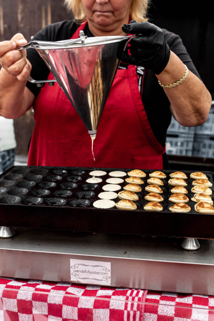 woman making poffertjes in 