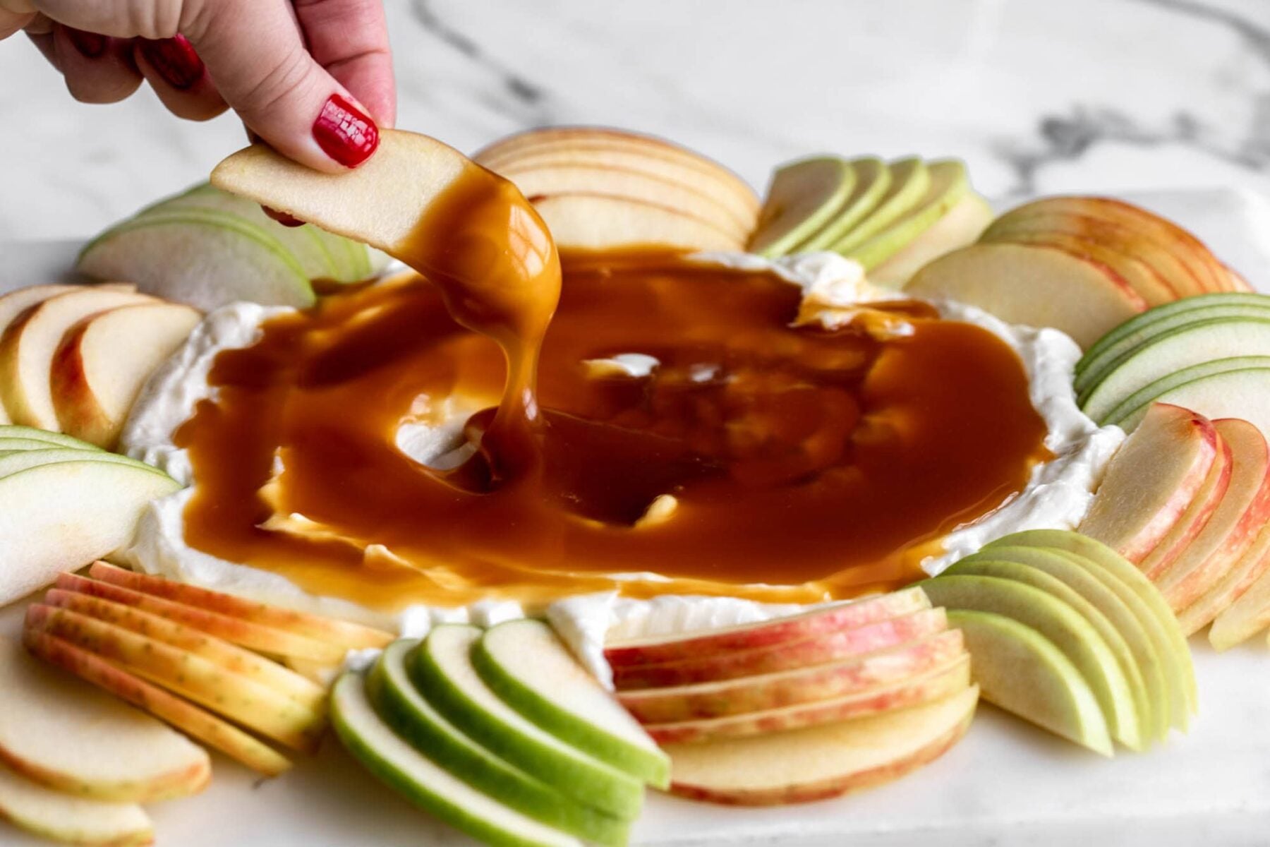 caramel apple dip with apple slices.