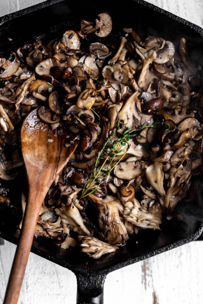 sautéed mushrooms with shallots and thyme in cast iron pan with miso paste