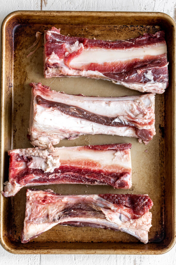 beef bones on baking sheet