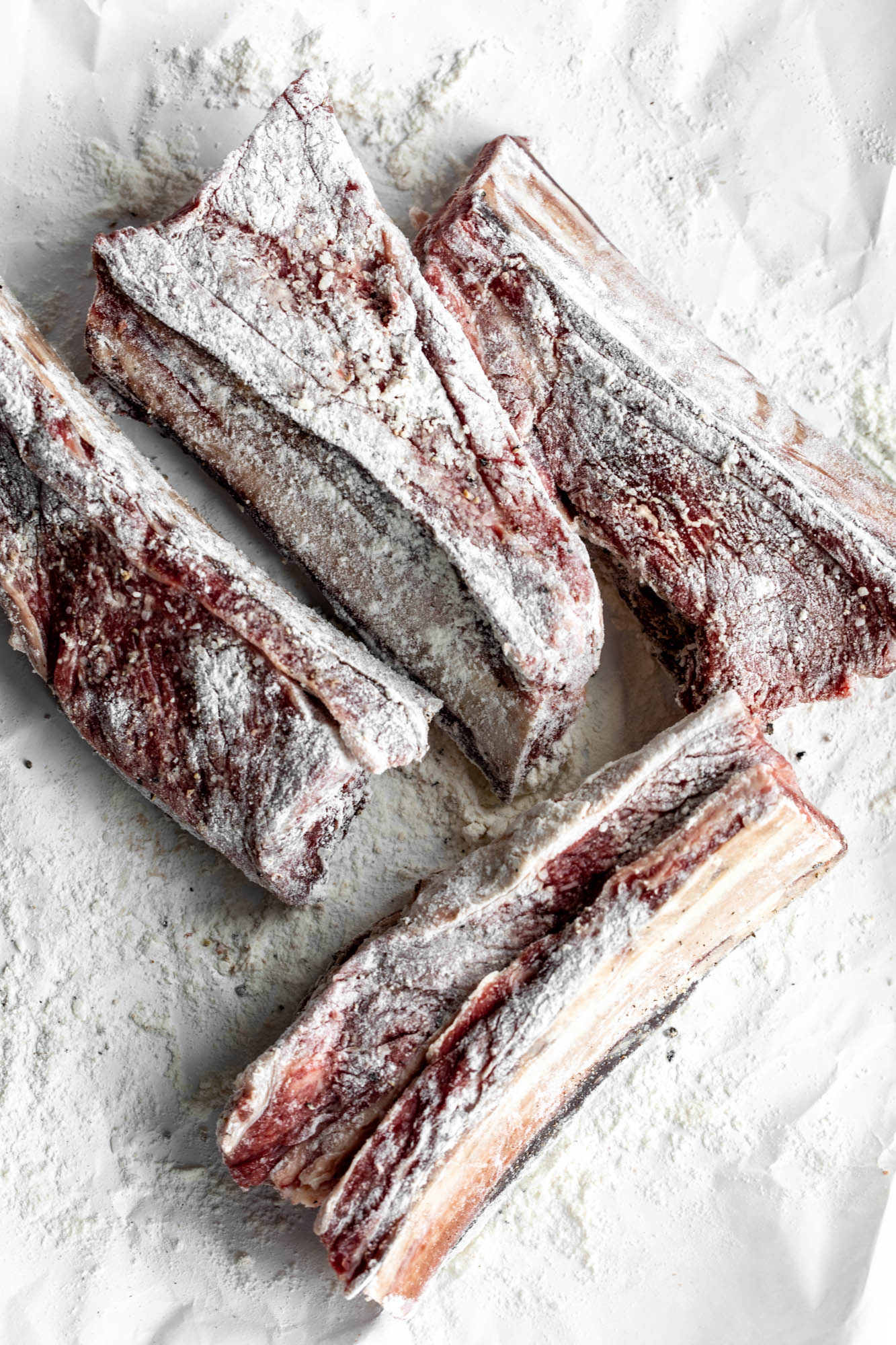 bone in short ribs seasoned with salt and pepper tossed in flour.