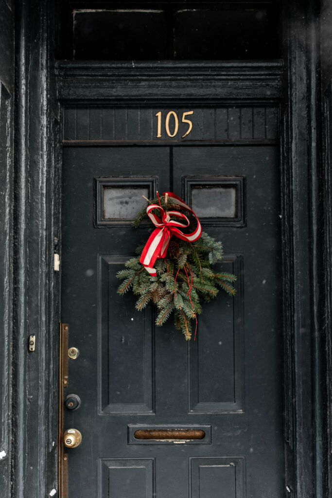 christmas wreath on brownstone door