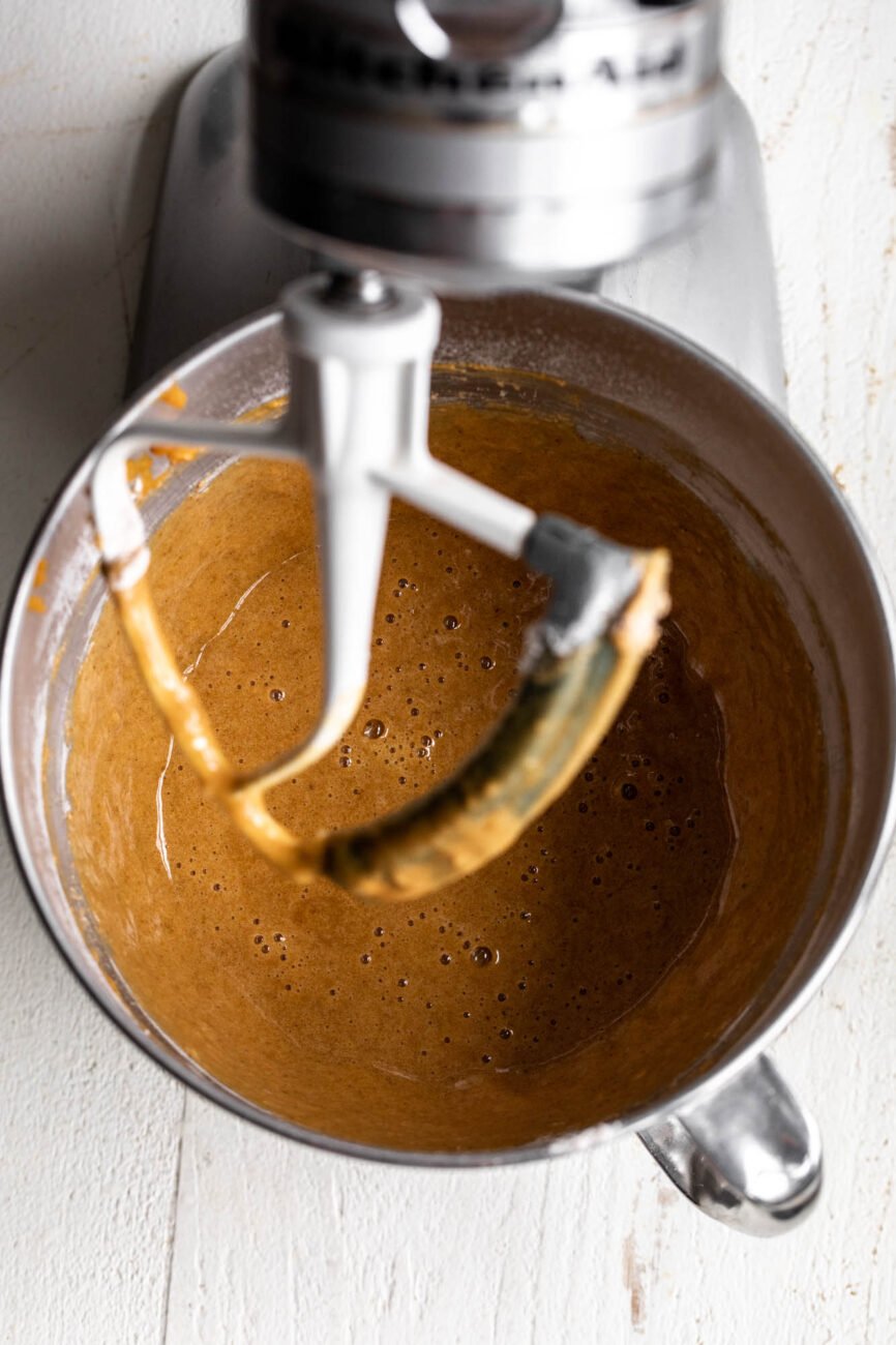 mixed batter for pumpkin roll in stand mixer with paddle attachment.