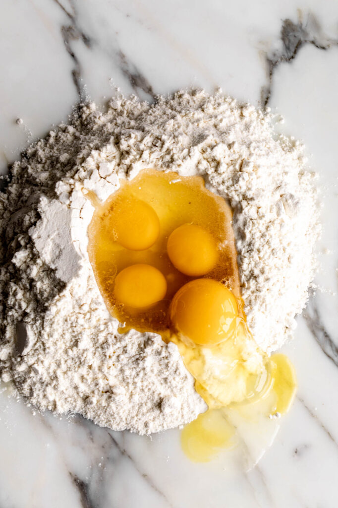 egg and dry ingredients for ravioli pasta dough