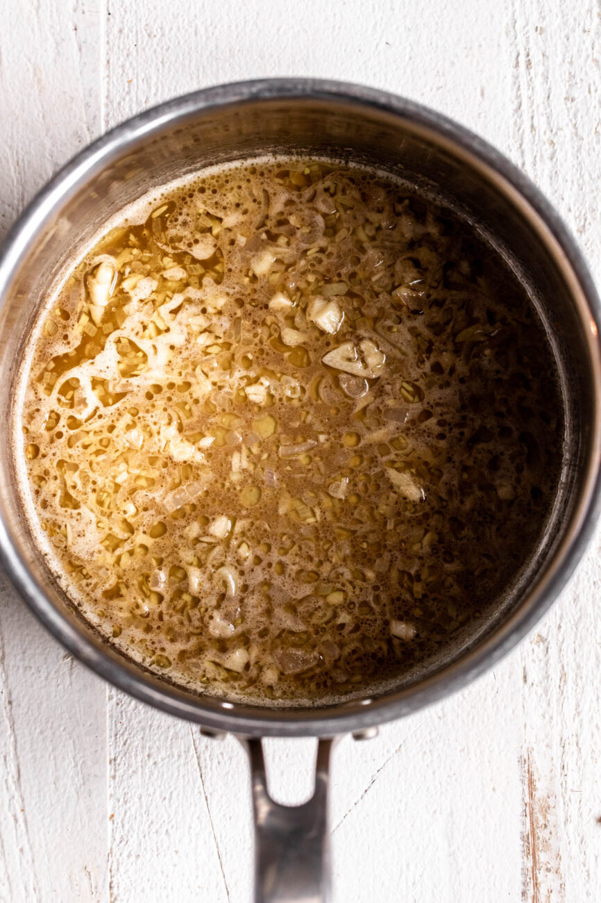 simmered beer with Worcestershire in pan.