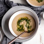 served creamy white bean soup with herb gremolata.