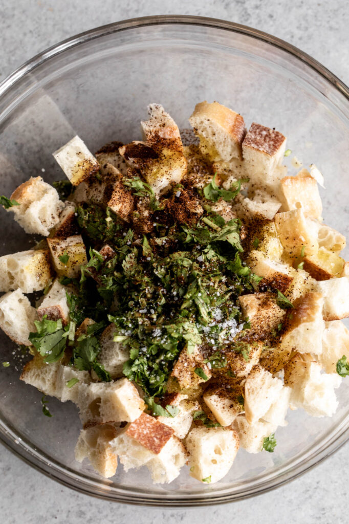 stale bread cubed in bowl to make croutons