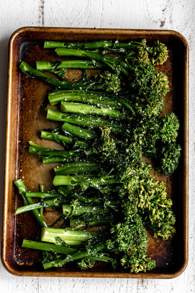 preparing Broccolini on pan