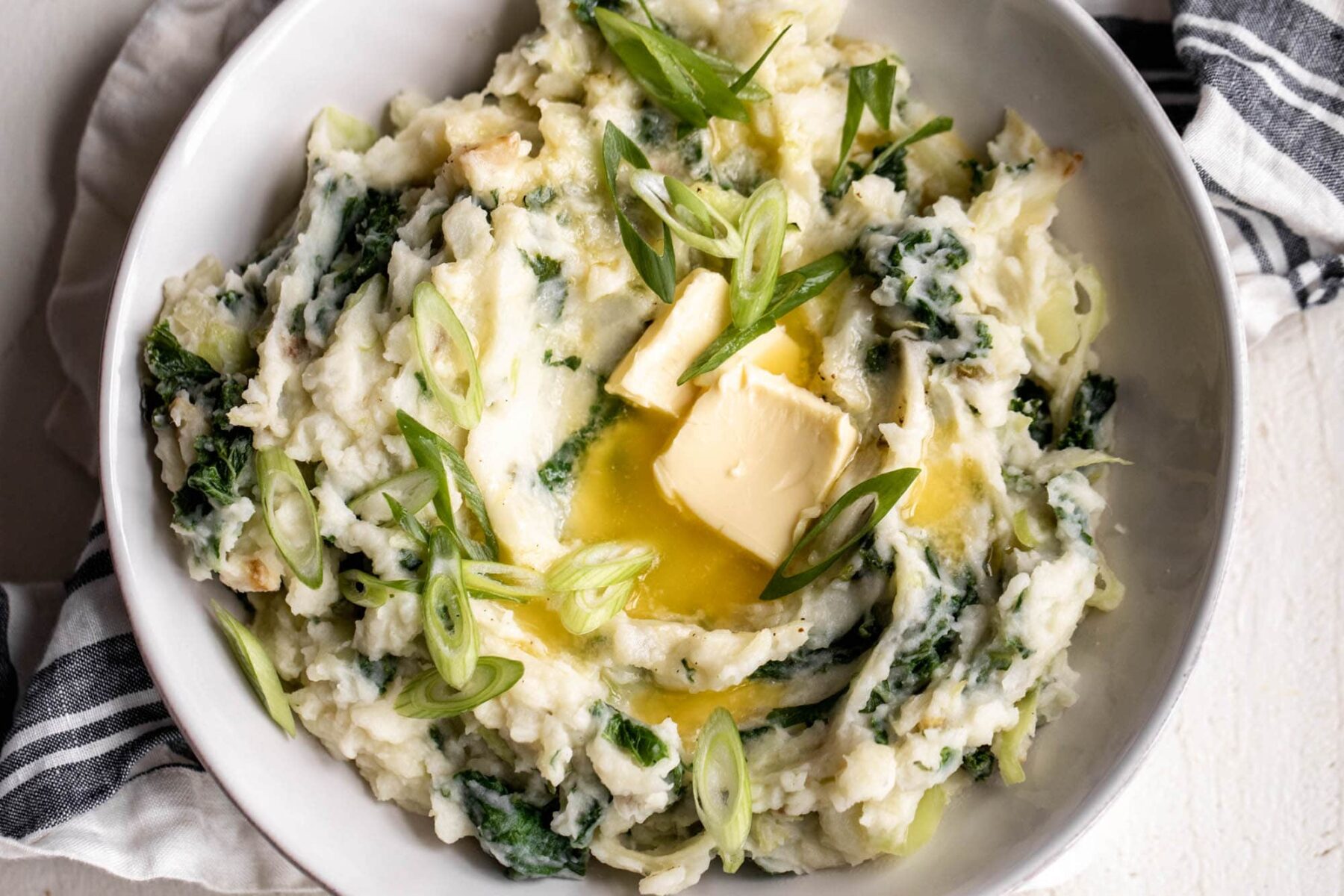 Creamy Irish colcannon with kale served in a rustic bowl.
