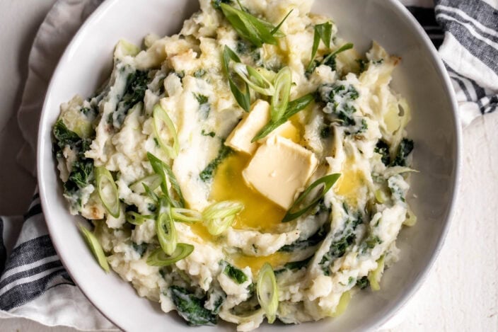 Creamy Irish colcannon with kale served in a rustic bowl.