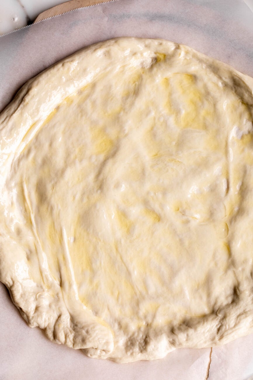 rolled out pizza dough for Baked Potato Pizza.