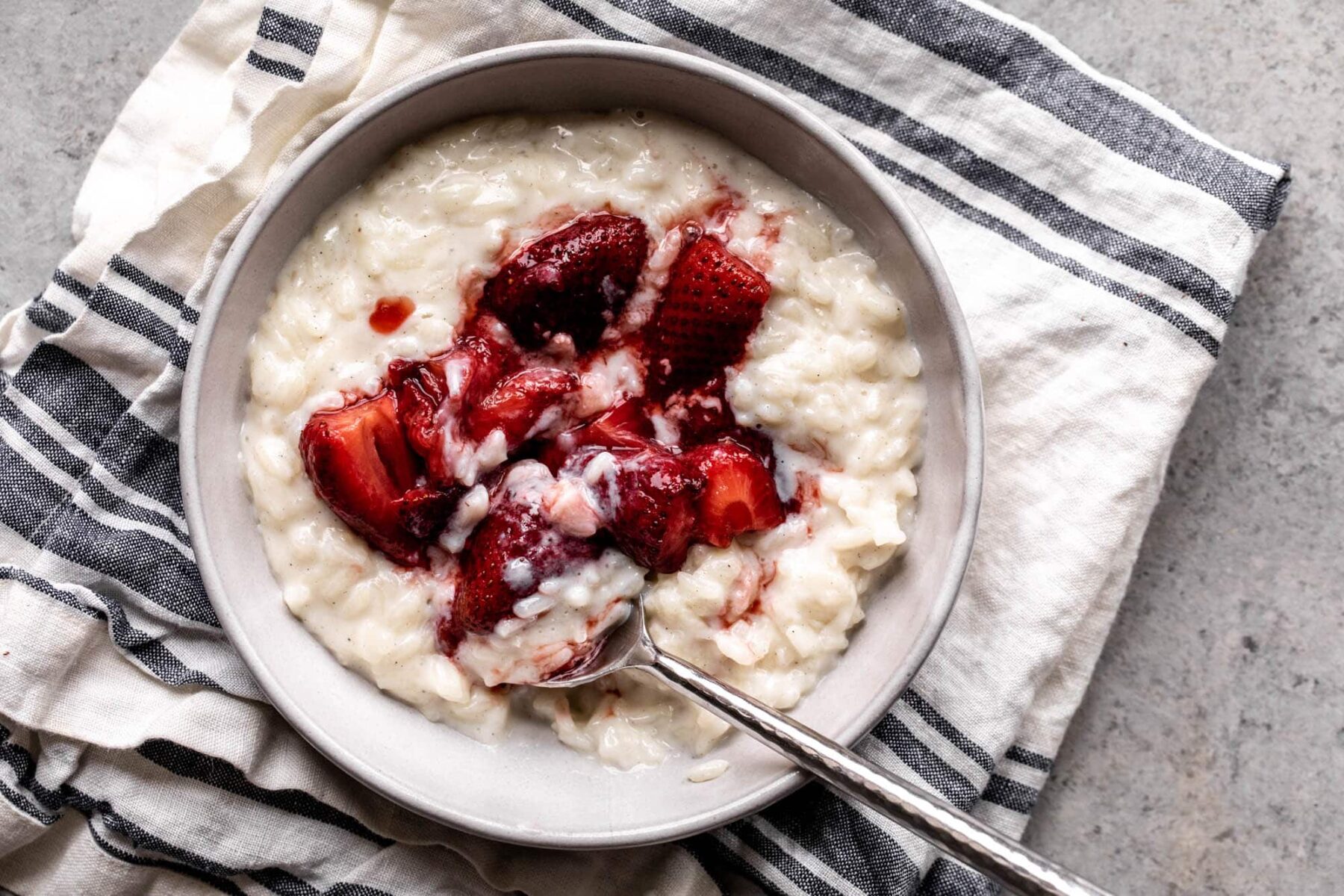 vanilla rice pudding topped with roasted strawberries.