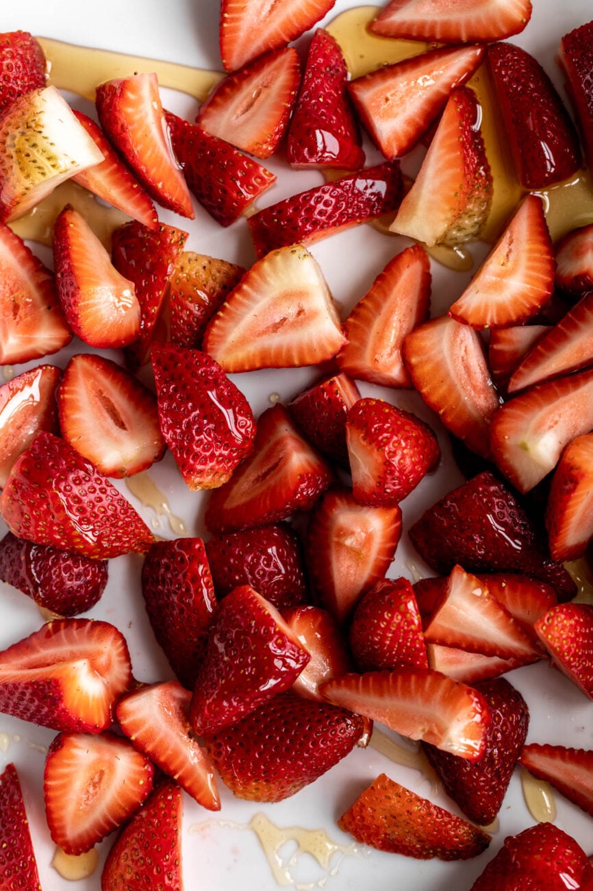 drizzled strawberries with honey for Roasted Strawberries.