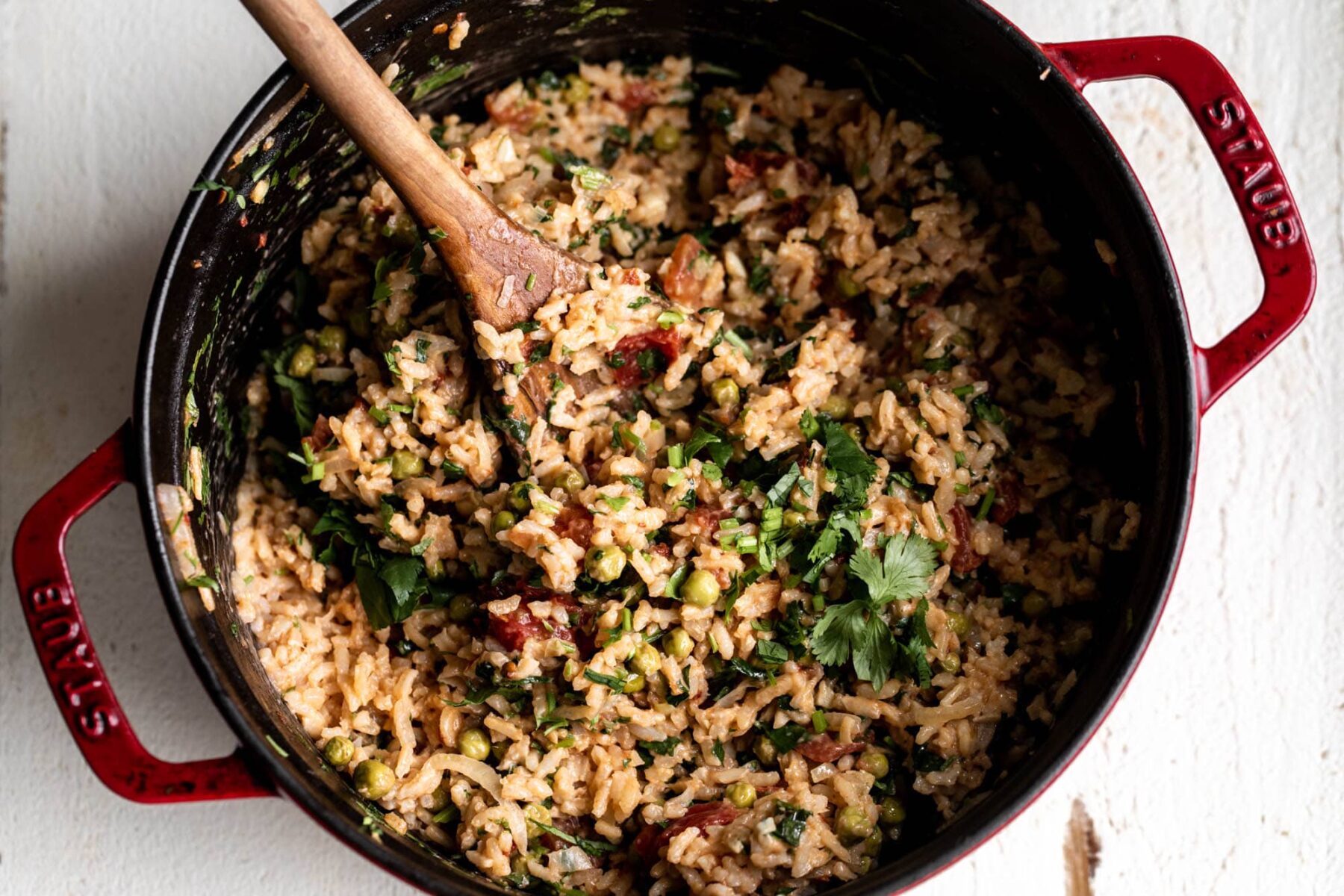 chimichurri rice with herbs in pot.