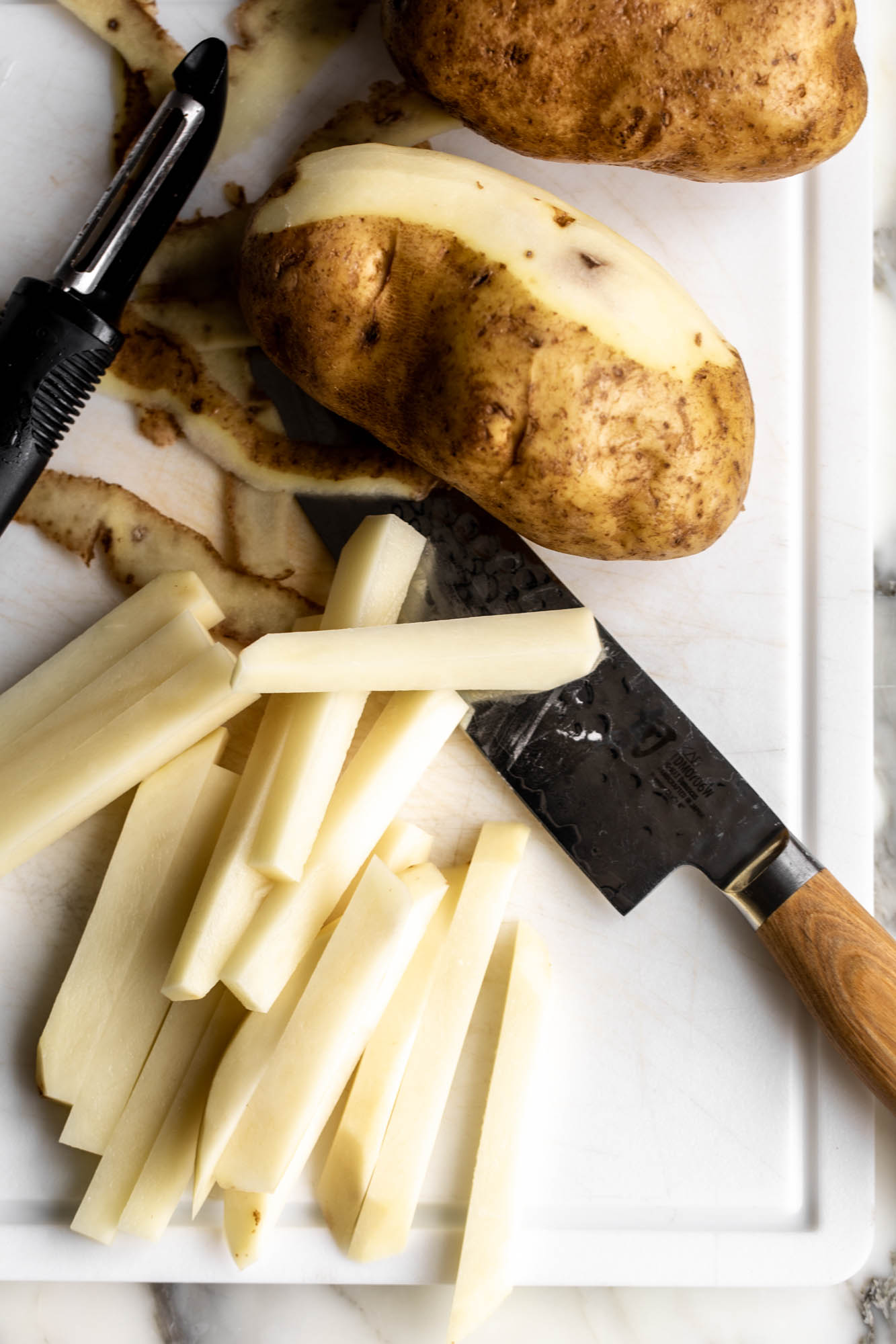 preparing potatoes for Fish and chips recipe