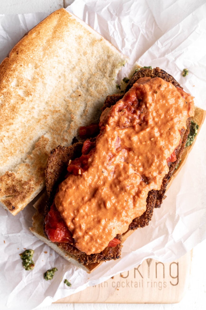 eggplant parmesan sandwich topped with vodka sauce.