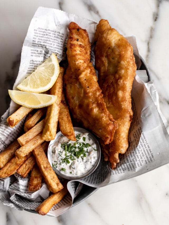 classic British England pub fare fish & chips fried with all-purpose flour, rice flour, beer & vodka. extra crispy golden pieces made using frying and broiler. freshly caught fish & served wrapped in newspaper with thick-cut French fries. inspired by Dame NYC an English seafood restaurant in the West Village & Heston Blumenthal’s