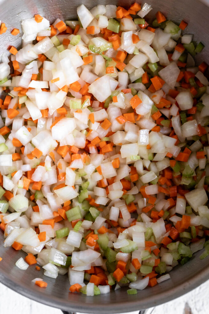 sautéed mirepoix carrots celery and onion in pot