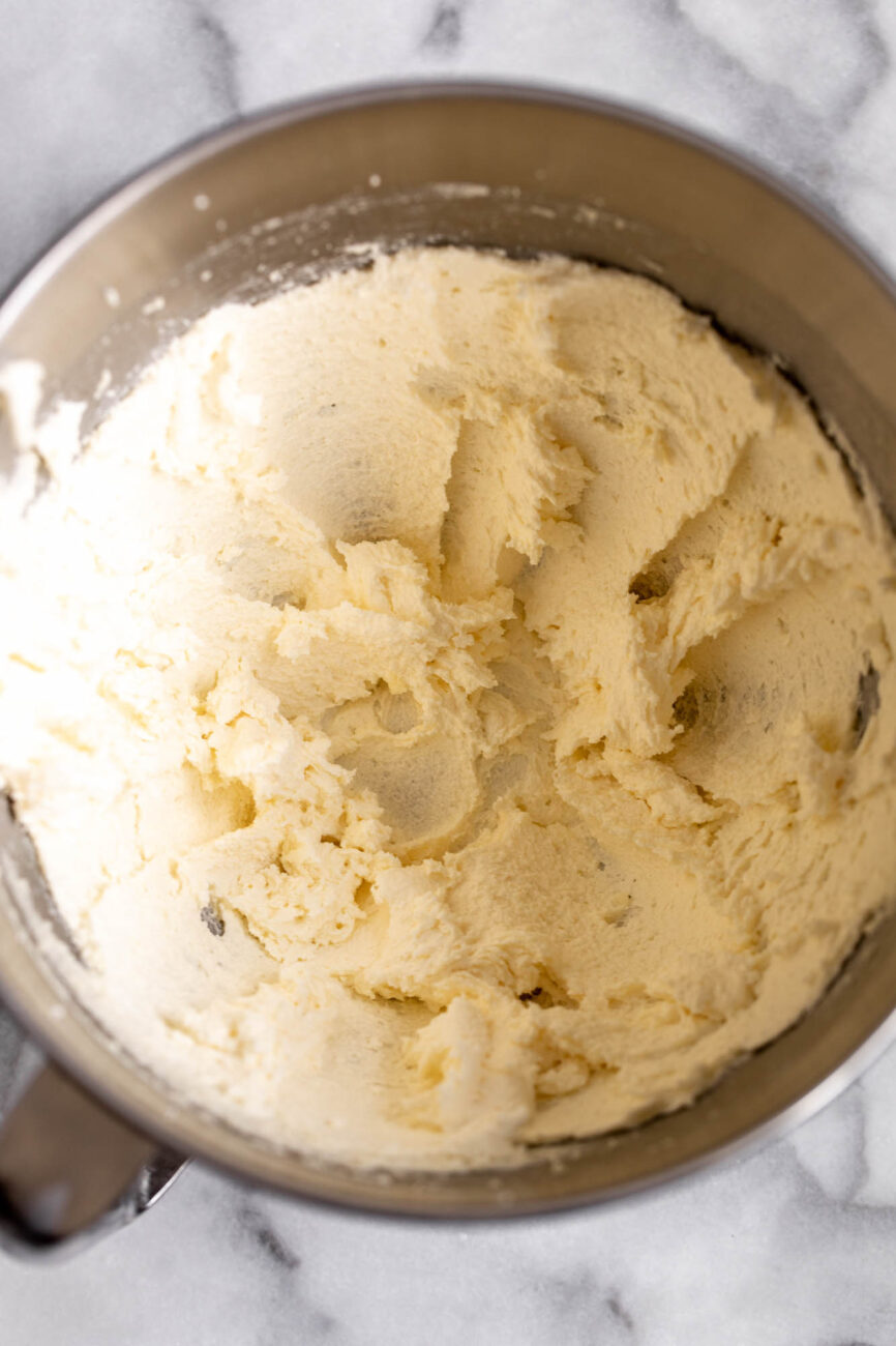 butter and sugar for Lemon Blueberry Cake.