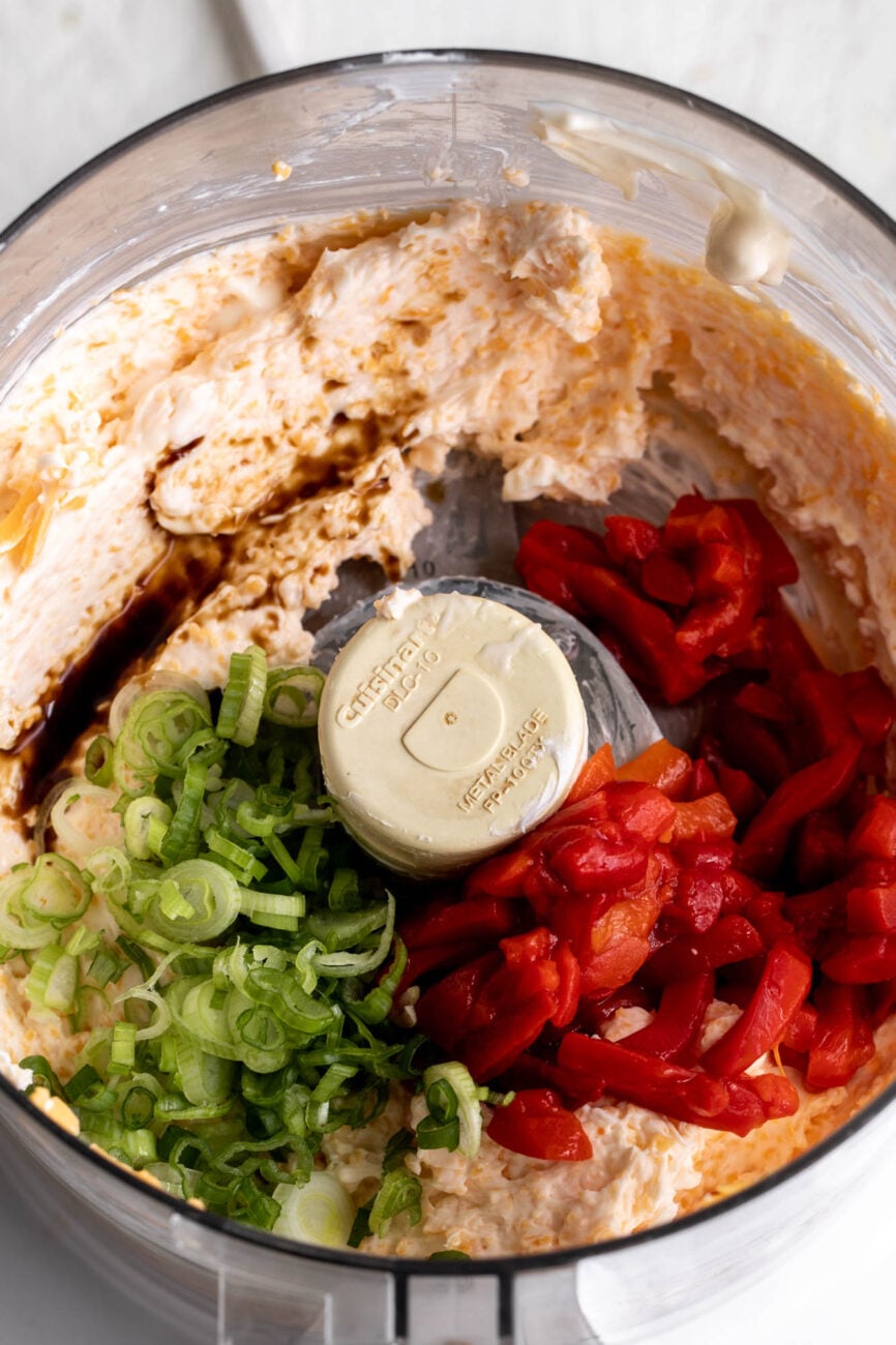 ingredients for pimento cheese for pimento cheese toasts in food processor.