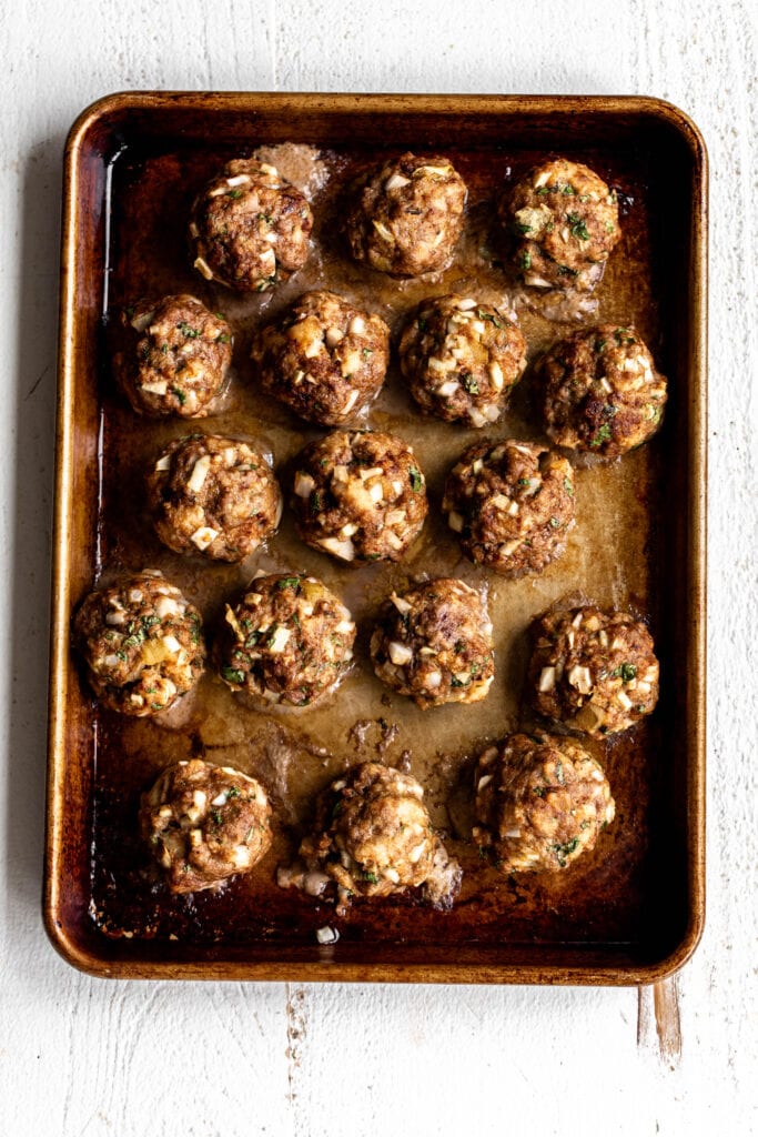 BBQ beef meatballs on baking sheet cooked
